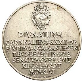 Coat of arms of the  Pope, and inscription,written in detail at  rightof photo