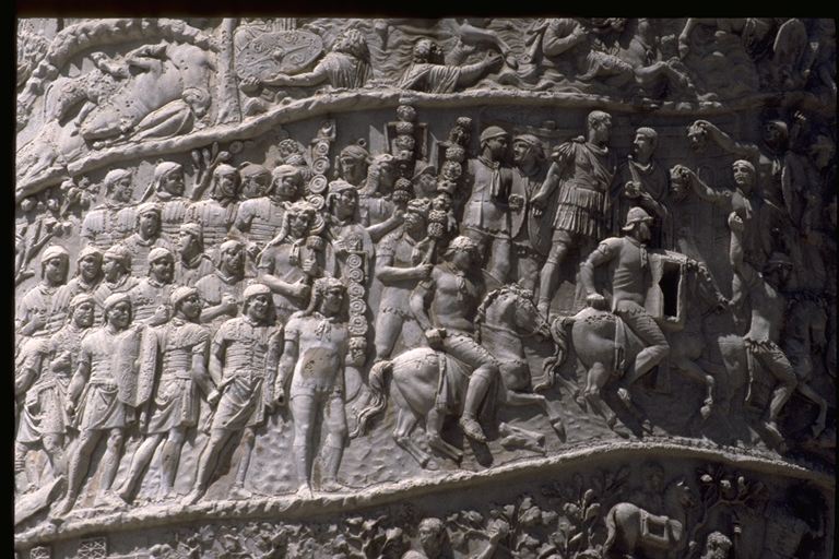 Section of Trajan's Column in Rome, showing the Emperor Trajan before an assembly of his army, cavalry soldiers riding past him