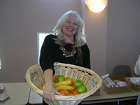Ellyn Gersh Lerner wrangling a fruit basket at the F08 Freshman Celebration