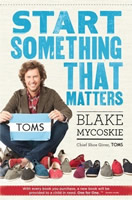 Book cover shows Blake Mycoskie seated cross-legged next to several pairs of TOMS shoes.