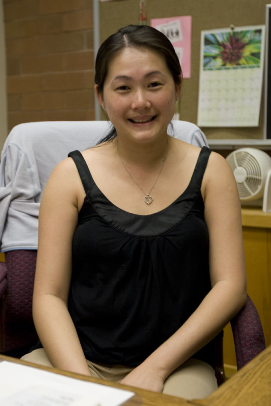 woman sitting behind desk