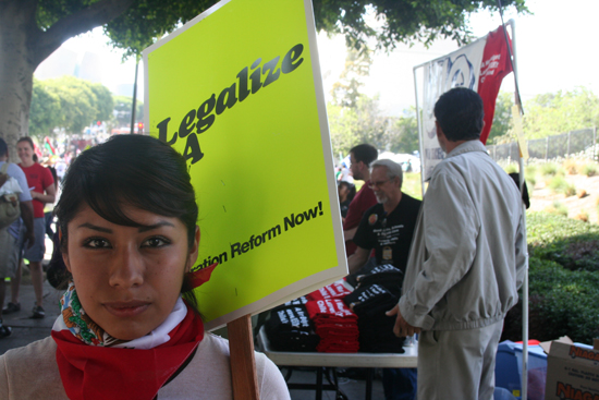 girl holding yellow sign