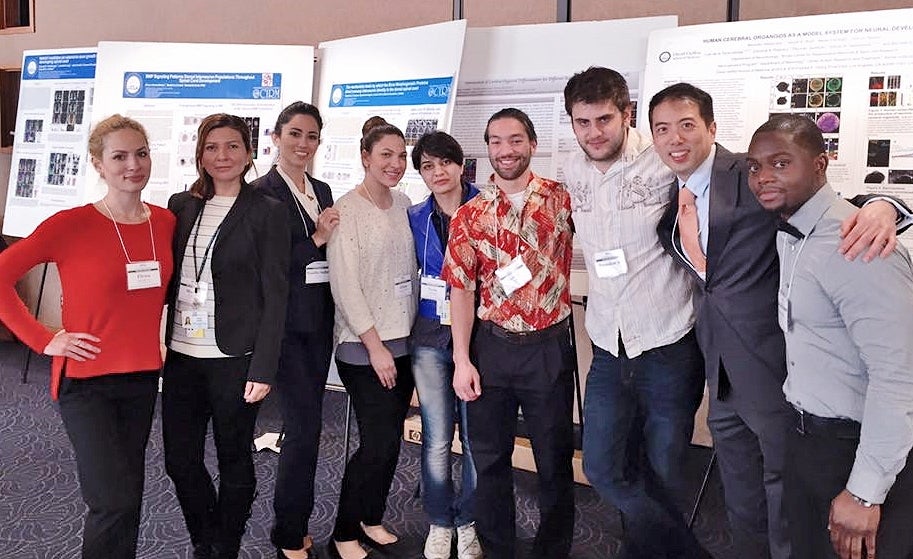 Bridges Students at symposium in front of their posters.