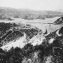 A black-and-white photo of the St. Francis Dam and resevoir
