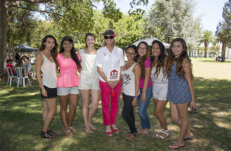 President Harrison with students at picnic.