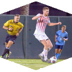 Men play soccer on field 