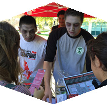 Students dressed as zombies participate in scavenger hunt.