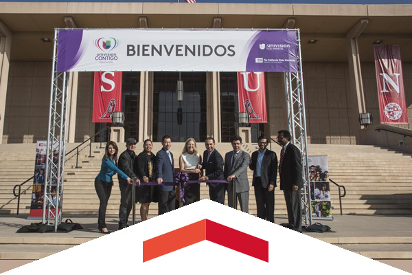 CSUN and Univision officials pose for a photo on the steps of the Oviatt Library