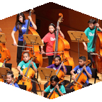 young students play in an orchestra