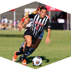 CSUN women's soccer forward Cynthia Sanchez runs from a defender. 