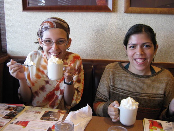 Ludmila and Thalyta tasting hot cocoa at Denny's.