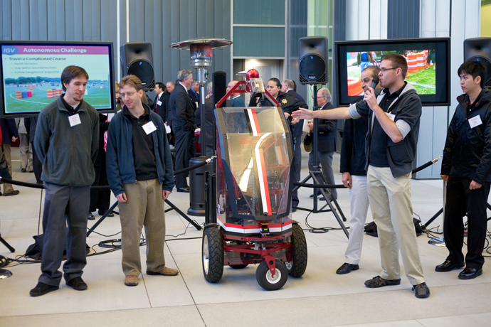 Students presenting National champion Intelligent Ground Vehicle at Inaugural Volunteer leadership Summit. 