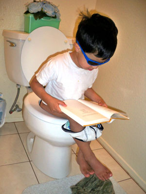 nephew on the toilet reading