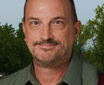 picture of Professor Steven Stepanek in front of a bookcase