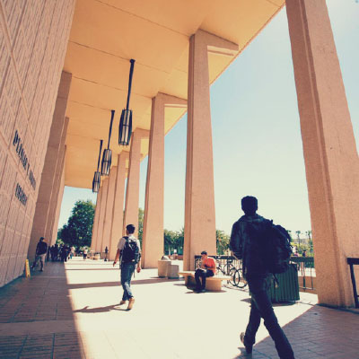 Students walking in front of the Oviatt entrance.