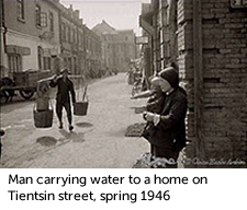 Man carrying water to a home on Tientsin street, spring 1946 