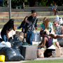 students pick up bags of donated clothes 