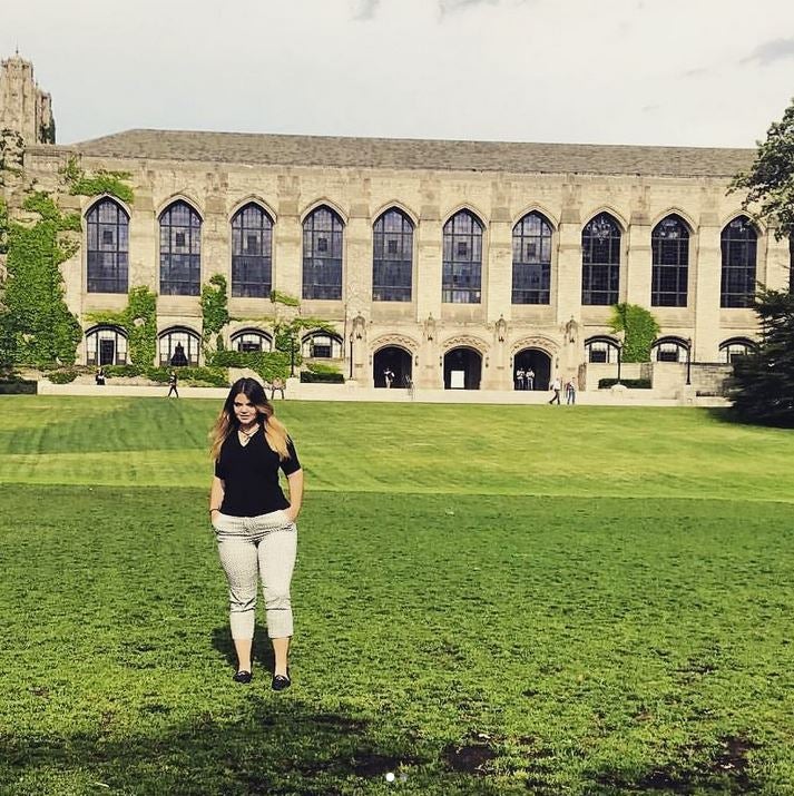 Daisy walks on Northwestern University campus lawn