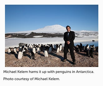 Michael Kelem standing with penguins