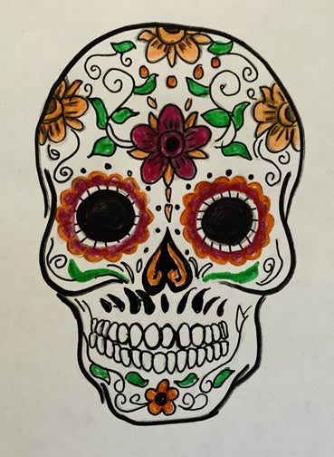 White skull outlined in black with colors on it. The two black circles for the eyes are surrounded by flowers that are red and orange. There are 4 large flowers on the forehead area and one small flower on the chin. The nose is an upside-down heart with two orange curly cues. There are green leaves all over the skull.