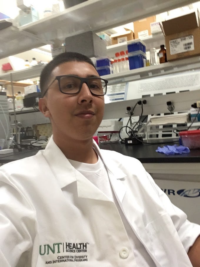 Lewis smiles in a selfie at the UNT Health Center Lab