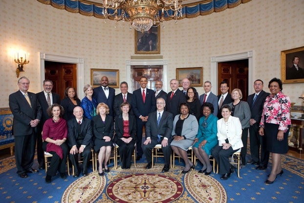 Steven Oppenheimer seated with other recipients of the U.S Presidential Award. President Obama is standing in middle of group.