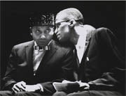 Malcolm X talking to Elijia Muhammed
