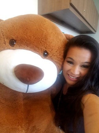 Person hugging stuffed bear