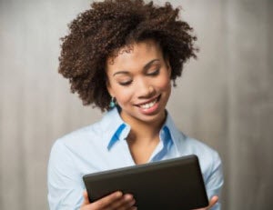 A professional woman using a tablet device
