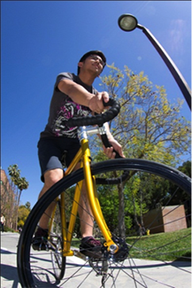 Male CSUN Student Riding a Bicycle