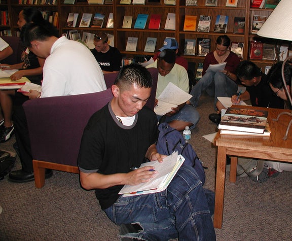 Students in reading room during open house event.