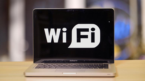 A laptop screen displaying the words "Wi-Fi". 