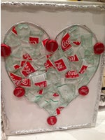 Heart made out of recycled Coca Cola bottles