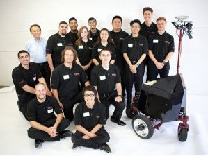 A photo showing members of the CSUN Engineering team and the team's robot, Vader.