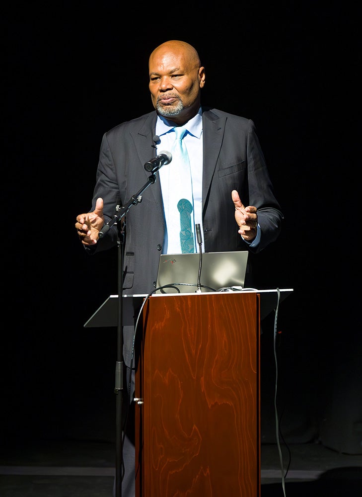 Dr. William A. Smith speaking on stage