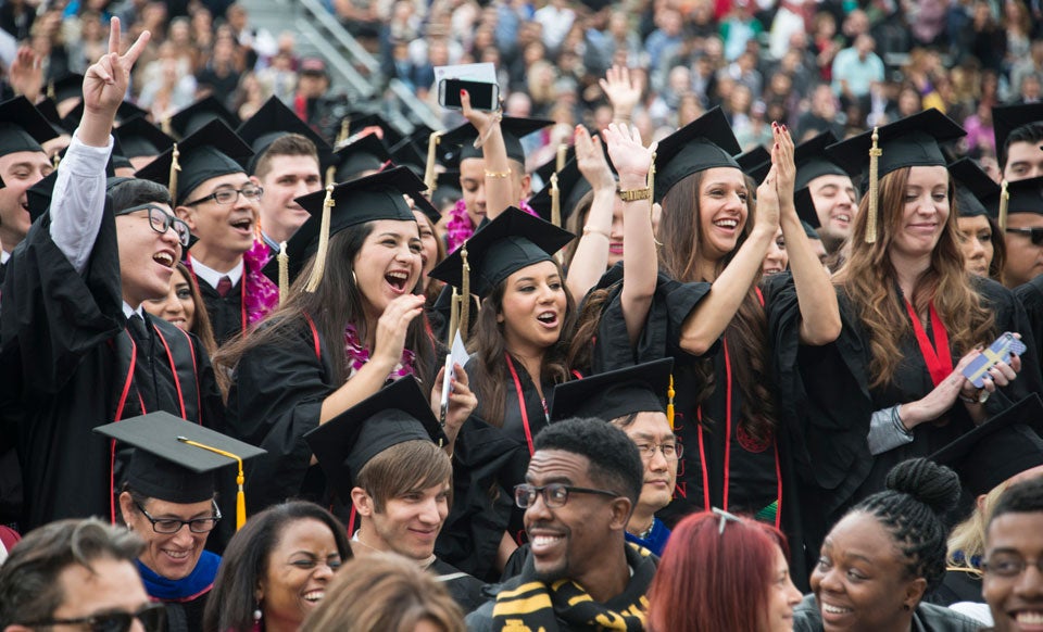 Graduates celebrating at of California State University, Northridge’s 2014 commencement ceremonies. Photo by Lee Choo.