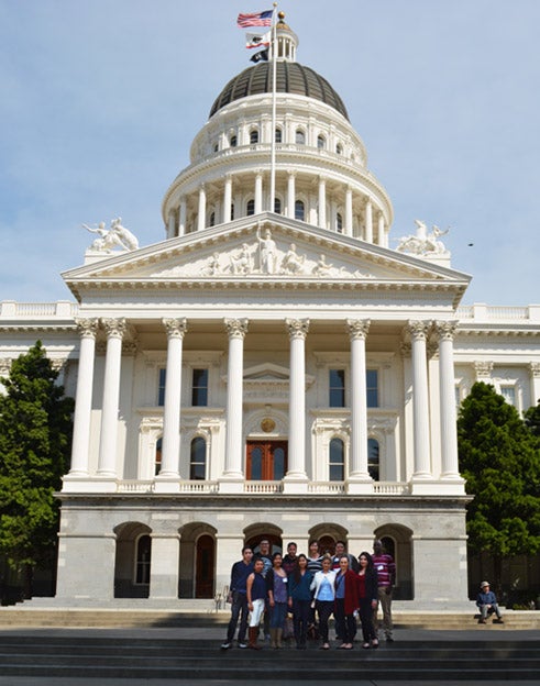 students in front of state capitol