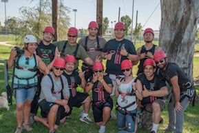 Before the veterans attempt to complete the High Ropes Course Challenge, they must participate in a series of team-building excersies. The exercises help the participants establish trust within the group. Photo by Viktor Kamont.