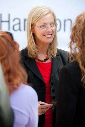 Photo of Dr. Harrison smiling at students.