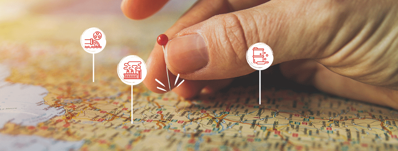 a hand putting a pin on a map of icons