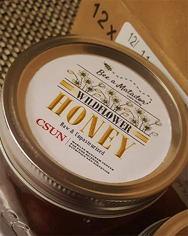 label on "bee a matador" honey jar lid