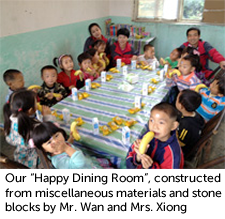 Our "Happy Dining Room", constructed from miscellaneous materials and stone blocks by Mr. Wan and Mrs. Xiong