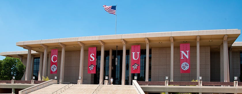 Photo of the Oviatt Library with display banners.