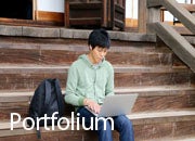 "Portfolium" graphic; A student using a laptop.  