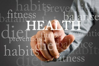 Hand pointing at the word "Health".