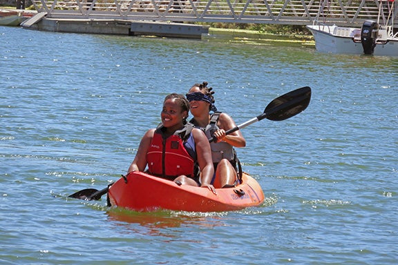 community members kayak on lake castaic