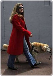 CSUN almuna and DRES student Courtney Mozzola with her guide dog.