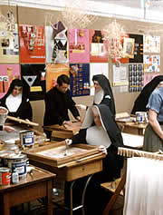 nun working in a silkscreen room