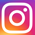 Instagram logo: sylized white camera drawing on a rainbow-colored back ground