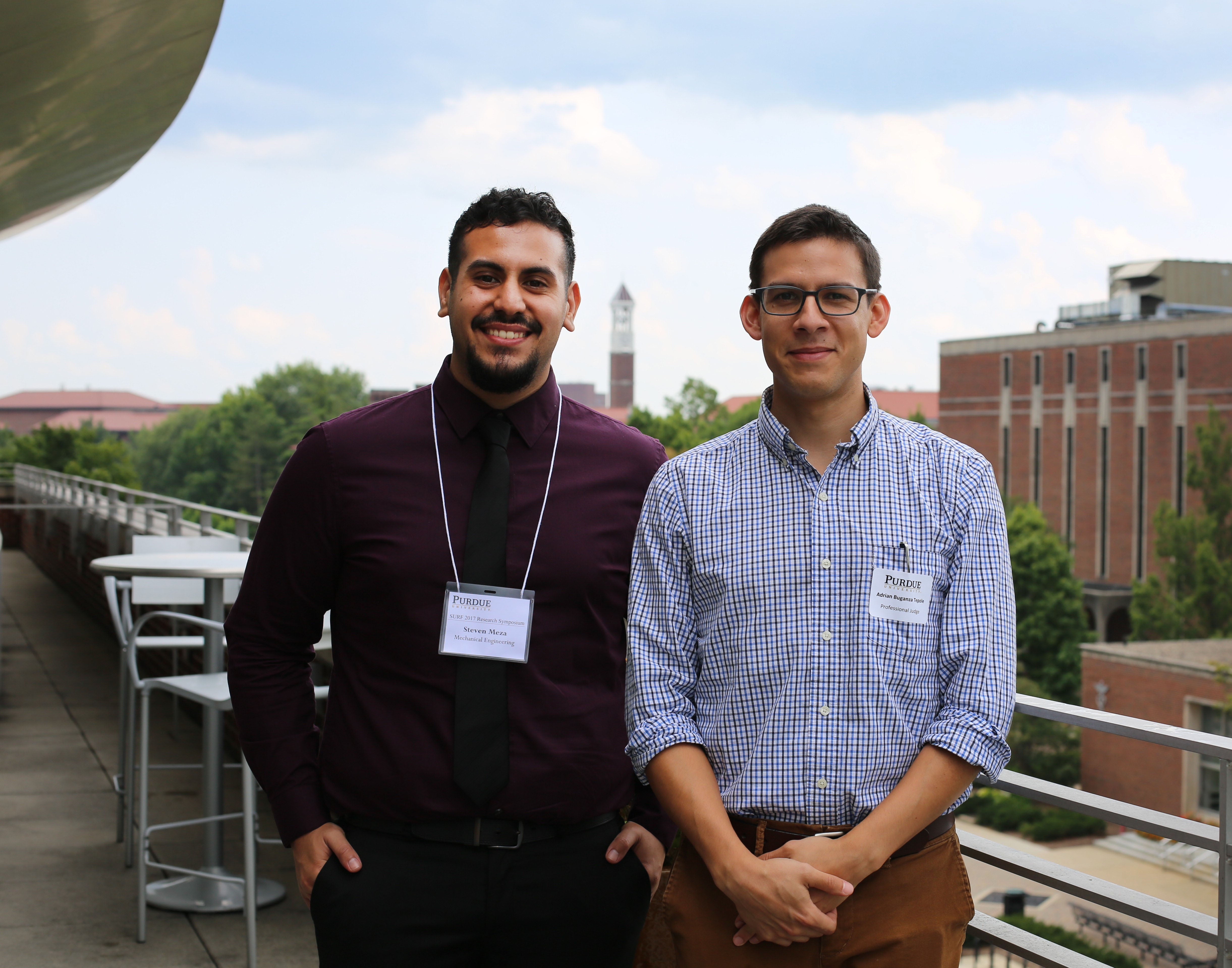 Steven poses with a colleague Adrian on balcony of Purdue Campus